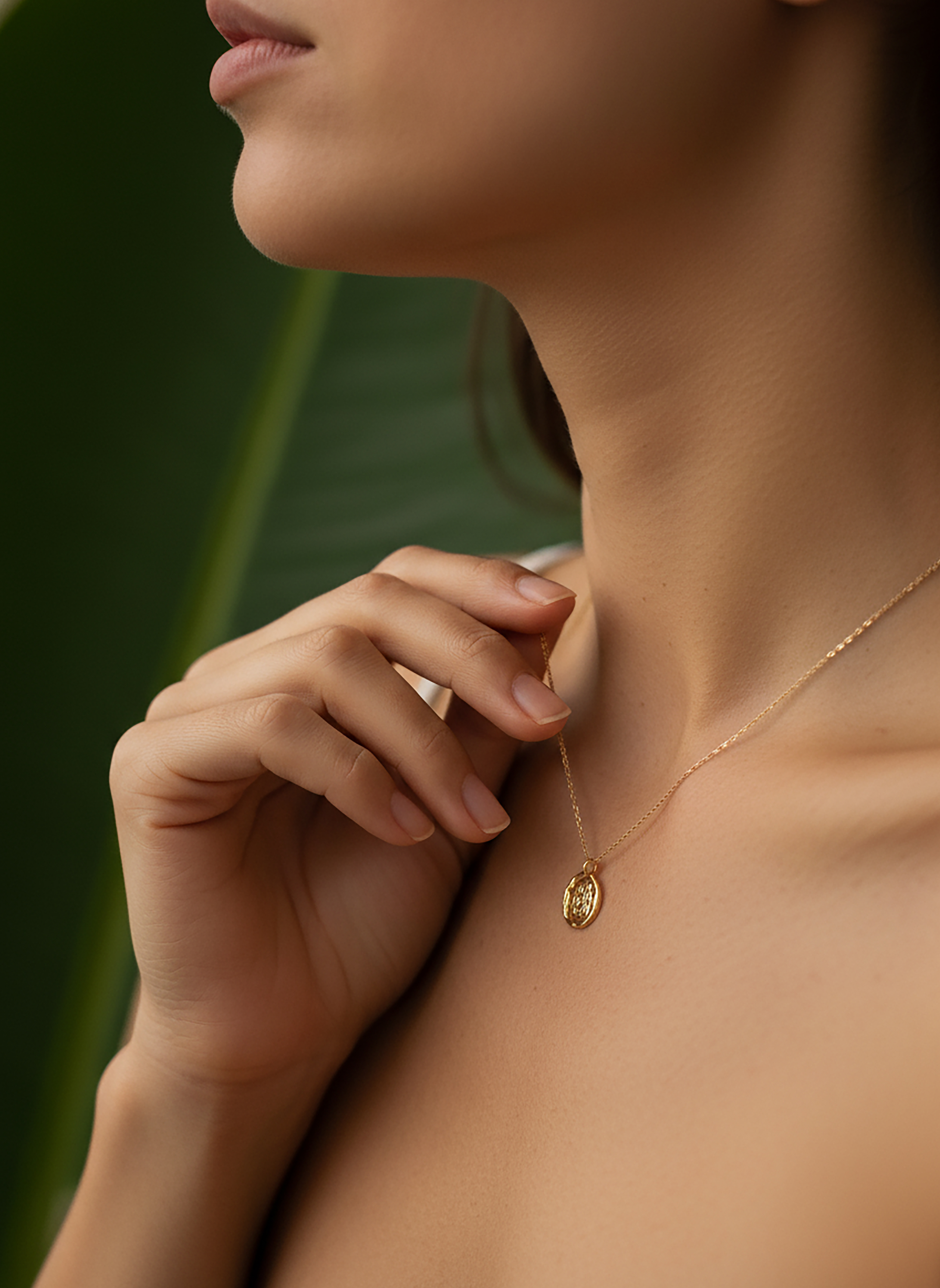 Conceptual brand world for Atelier Verde, showcasing a woman touching a delicate gold necklace.